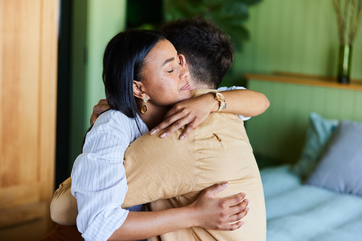 couple that is stressed and hugging it out.