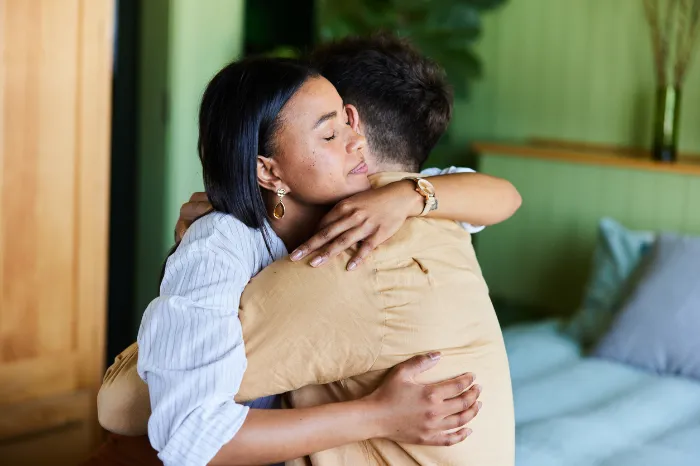 couple that is stressed and hugging it out.